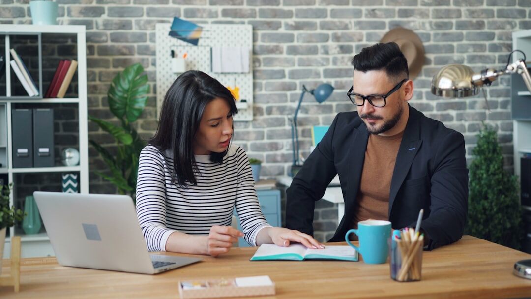 instructor helping student at desk