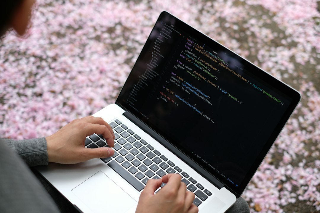 student learning coding on laptop