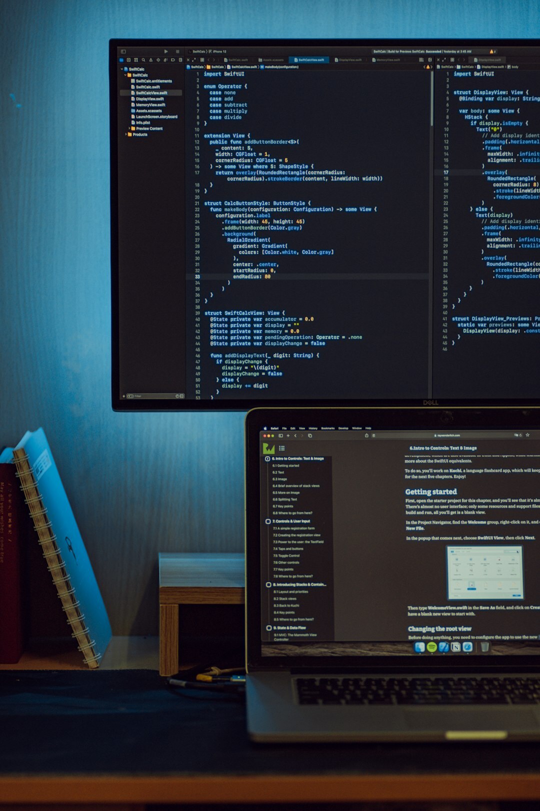 student coding on laptop