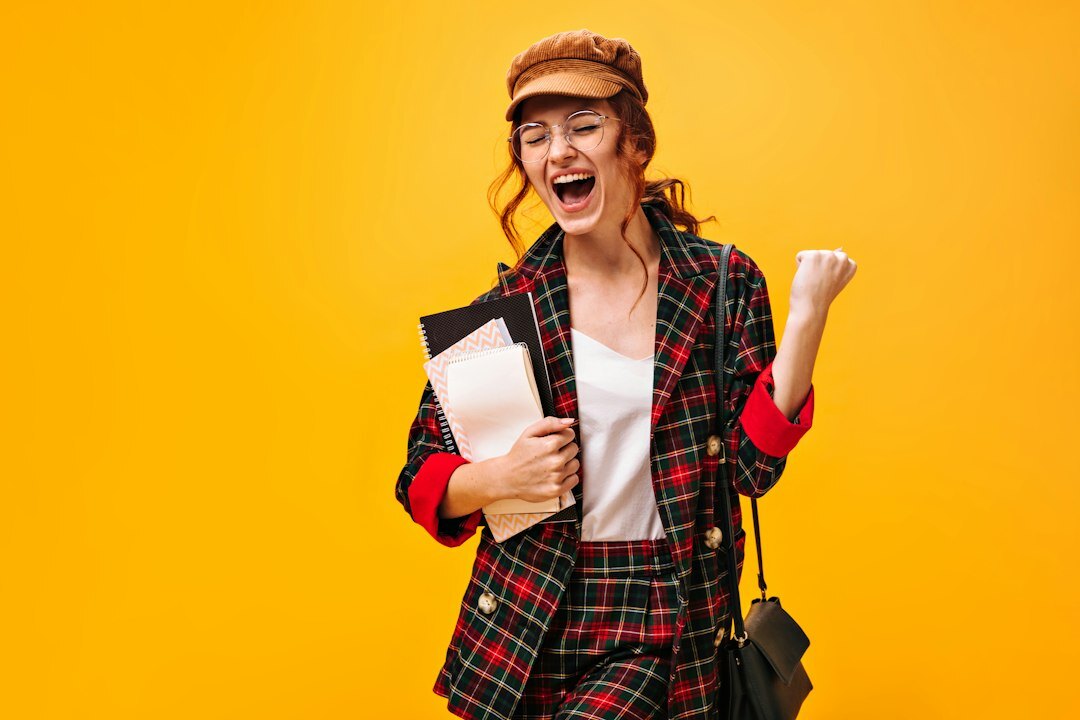 happy student celebrating english course win