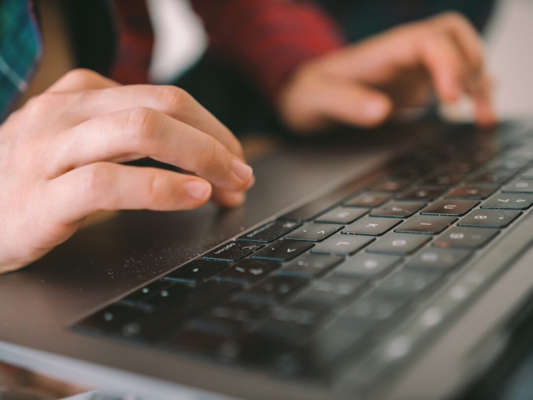 student learning coding on laptop