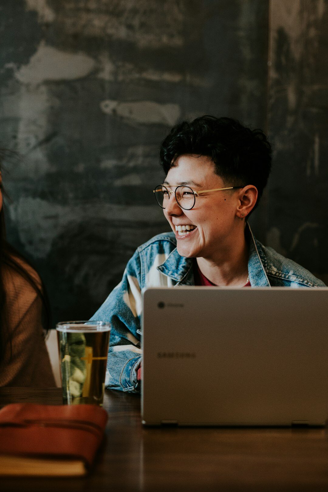 person coding happily on laptop